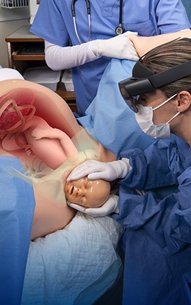 Learners see the internal intrapartum anatomy of the VICTORIA simulator using Obstetric MR Mixed Reality Training System.